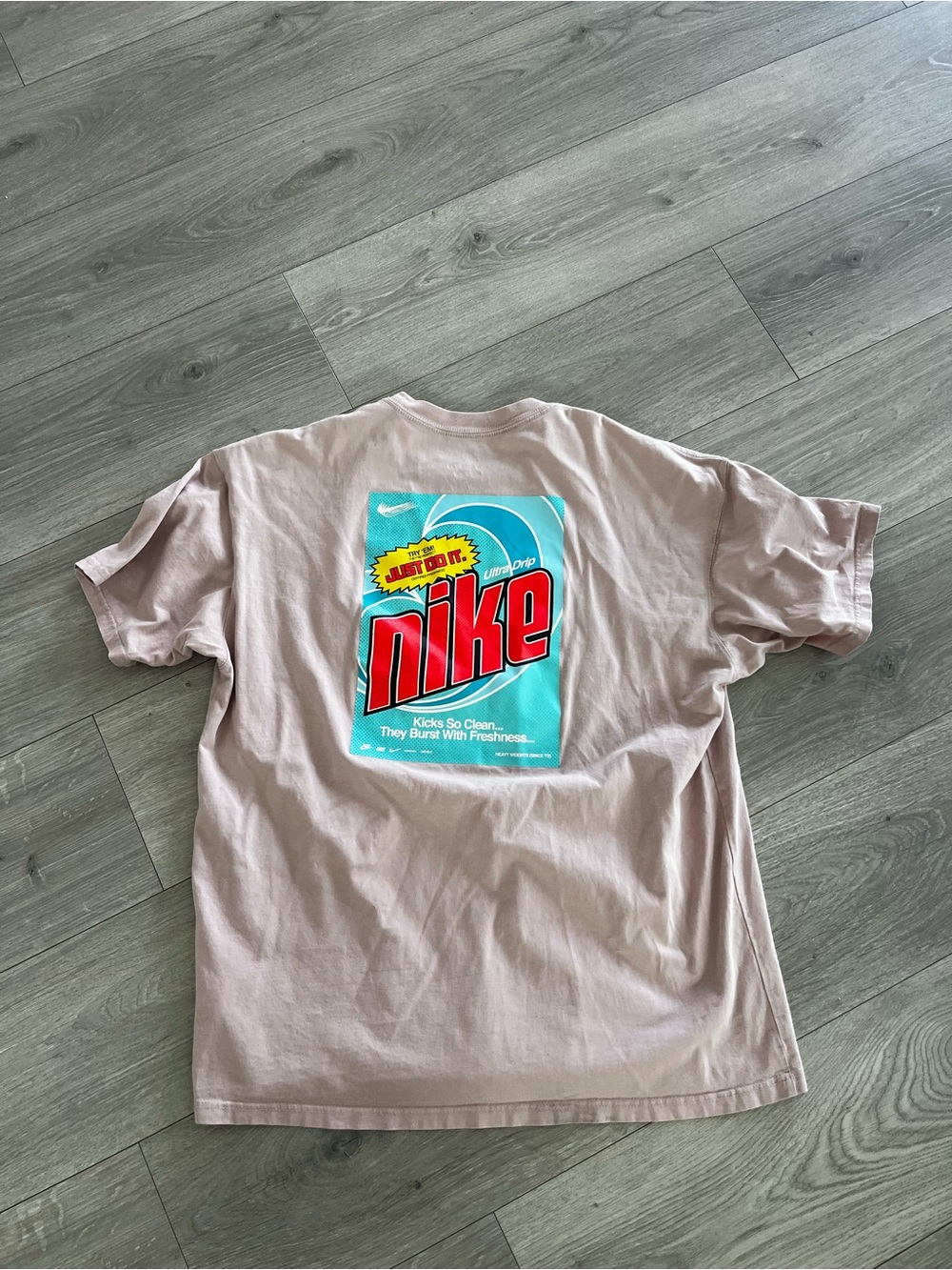 Nike Graphic Tee in Light Pink with Teal & Red Back Print